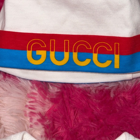 Gucci Kids' White Bib, Onesie And Beanie Set with Blue, Red, and Yellow Accents - Picture 6 of 7